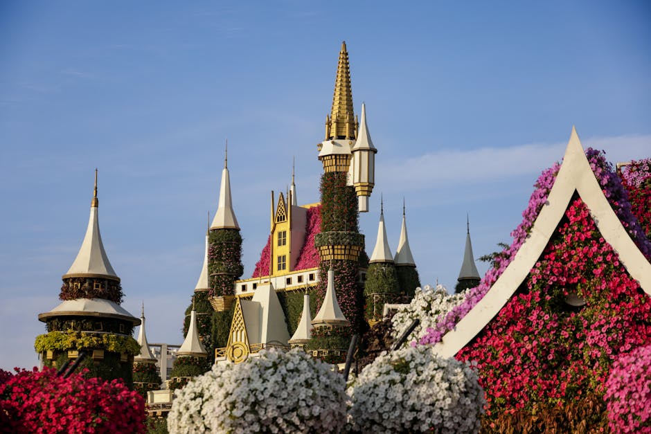 A stunning floral castle surrounded by vibrant blooms in a picturesque garden setting.