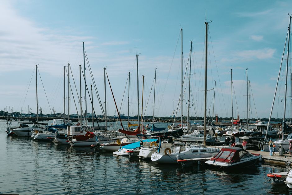 Scenic view of sailboats in Tallinn's marina, Estonia on a sunny day.