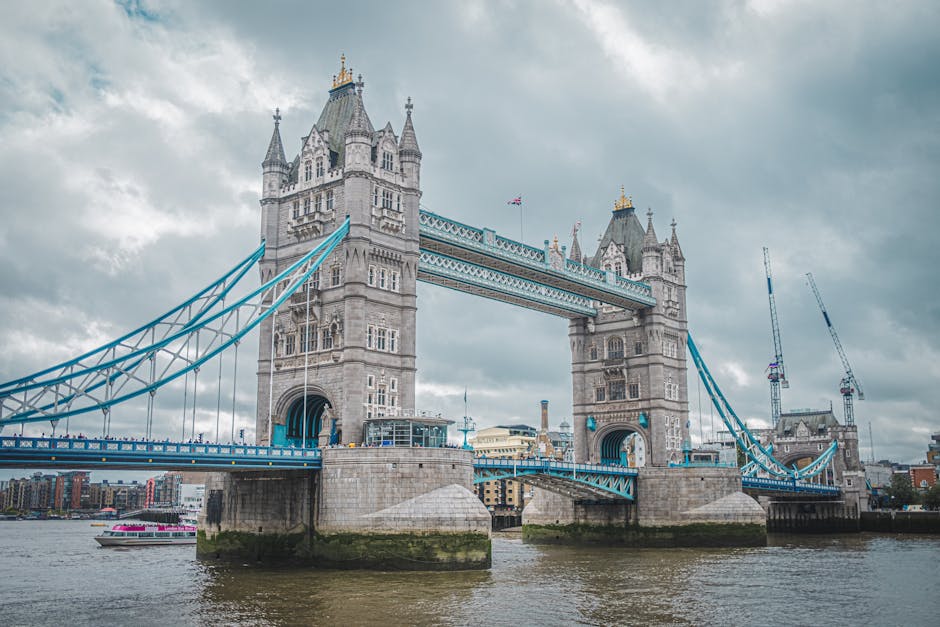 Scenic view of Tower Bridge in London on an overcast day, capturing urban architecture.