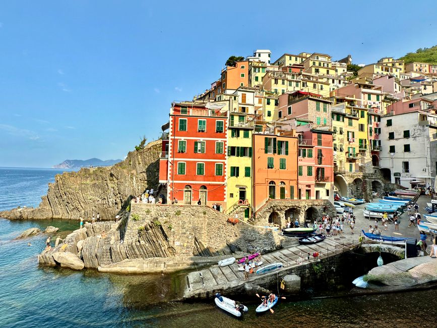 Vibrant coastal village with colorful buildings in Riomaggiore, Cinque Terre, Italy.