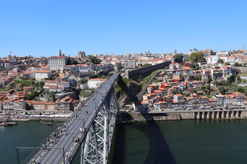 Aerial view of the iconic Dom Luís I Bridge spanning the Douro River in Porto, Portugal.