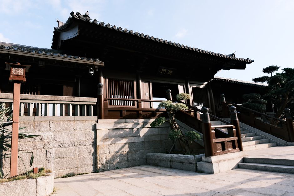Beautiful view of traditional East Asian temple with ornate roof and stone steps.